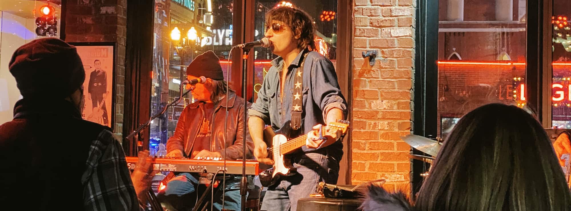 bar singer on guitar in Denver