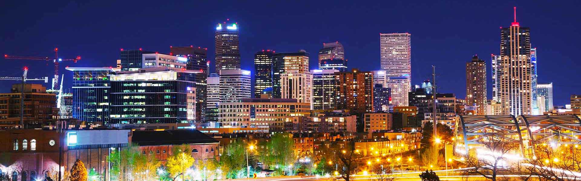 Neon color image of a band playing and people singing along